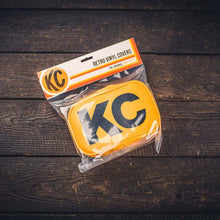 Cargar imagen en el visor de la galería, KC HiLiTES Retro 5in x 7in Rectangular Yellow Vinyl Light Cover w/ Black KC Logo (Pair)