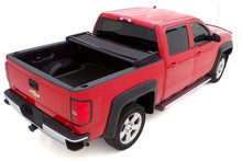 Cargar imagen en el visor de la galería, Lund 04-17 Nissan Titan (5.5ft. Bed w/o Titan Box) Genesis Elite Tri-Fold Tonneau Cover - Black