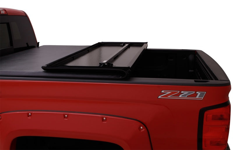 Lund 04-15 Nissan Titan (5.5ft. Bed) Hard Fold Tonneau Cover w/Bracket Kit - Black