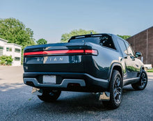 Load image into Gallery viewer, Rally Armor 22-25 Rivian R1T Black UR Mud Flap w/Tangerine Scream Logo